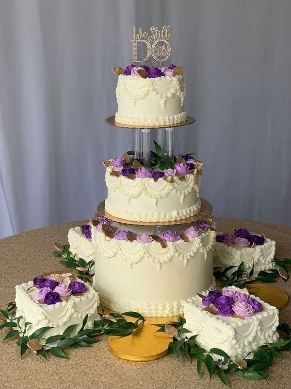 Purple Flowers on multi tiered cake